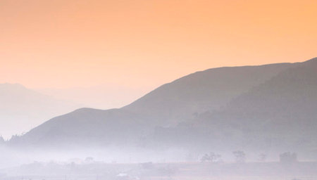 Foggy morning in the mountains. Panoramic view.の写真素材