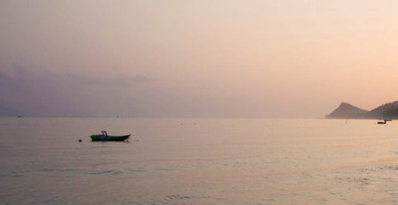 Fishing boat in the sea at sunset. Koh Phangan, Thailandの写真素材