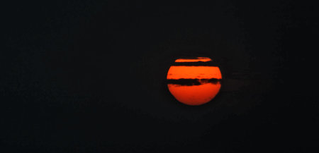 Sunset in the evening sky. Panoramic view of the sun.の写真素材