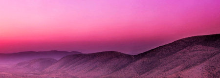 Beautiful sunset in the mountains. Panoramic view of the mountains.の写真素材