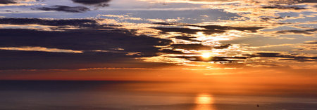 Sunset over the sea. Panoramic view of the sea at sunset.