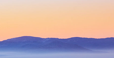 Sunrise in the mountains. Panoramic view of the mountains.
