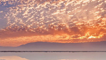 Sunset over the lake with mountains in the background, California, USAの写真素材