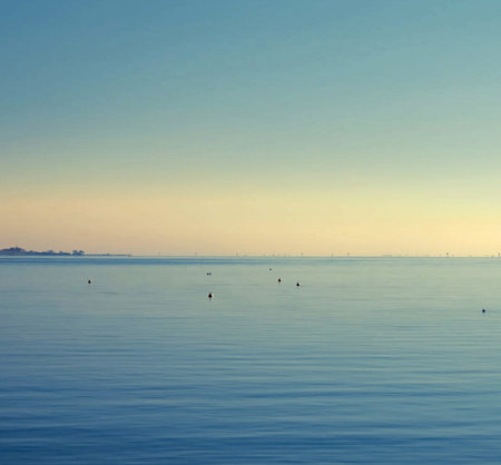 Beautiful seascape with blue sky and white clouds at sunset