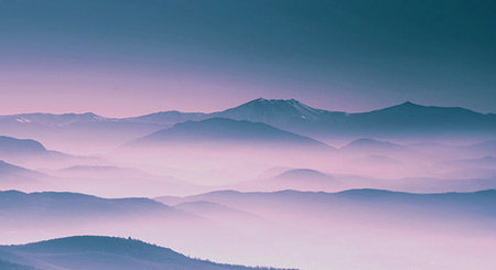 Beautiful mountain landscape with fog in the morning. Colorful filter.の写真素材