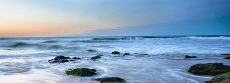 Beautiful sunset on the beach of Sri Lanka. Panoramic image.
