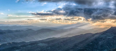 Sunset in the mountains. Panoramic view of the mountain range.の写真素材