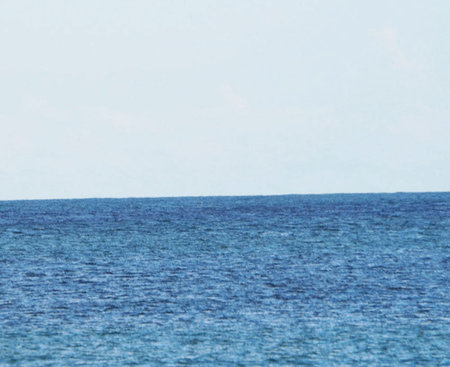 Blue sea and sky background. Natural texture of the sea surface.の写真素材