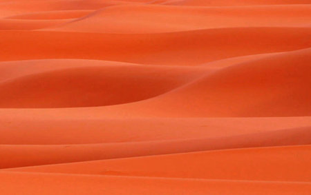 Orange sand dunes in Mui Ne, Vietnam, closeup of photoの写真素材