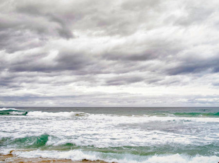 beautiful seascape with stormy sky, waves and cloudsの写真素材