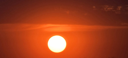 Beautiful sunset in the sky. Panoramic view of the sun.の写真素材