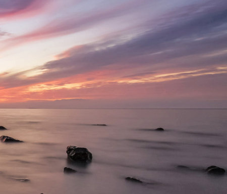 Beautiful seascape at sunset. Nature composition. Long exposure.の写真素材