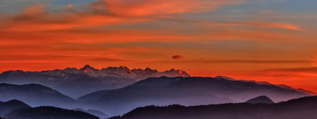 Sunset in the mountains. Panoramic view of the Alps.の写真素材