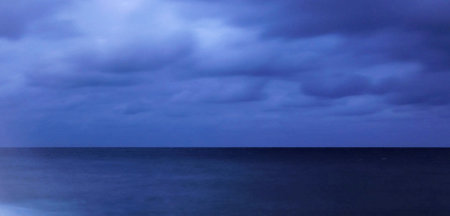 Stormy sky over the sea. Nature composition. Long exposure.の写真素材