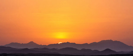 Sunset over the mountains in Egypt. Panoramic view.の写真素材