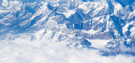 Aerial view of Himalaya mountain range with snow and clear blue skyの写真素材