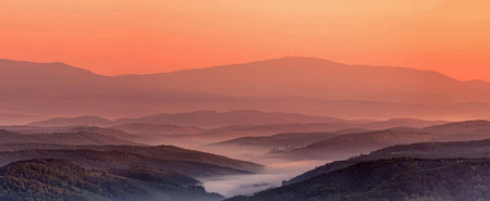 Foggy morning in the mountains. Panoramic view.の写真素材