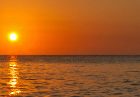 Beautiful sunset over the sea. Sunrise over the sea. The sun sets over the sea.
