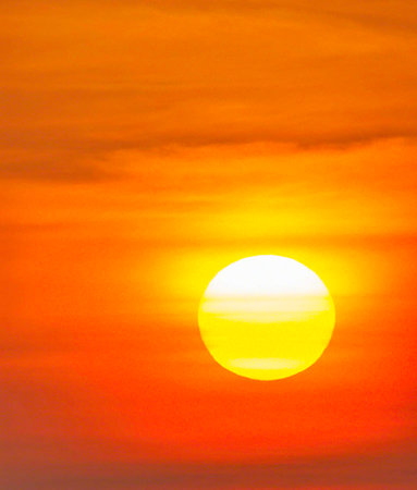 Sunset over the sea in the evening. The sun at sunset.の写真素材