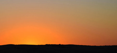Sunset over the dunes in the Arabian desert of Egypt.の写真素材