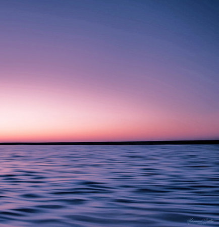 Sunset over the sea with reflection in water. Nature background.の写真素材