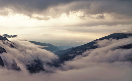Mountain landscape with clouds and fog. Caucasus Mountains, Georgia.