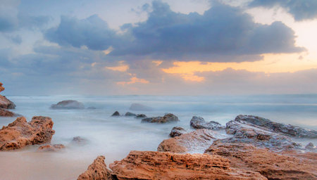Beautiful seascape at sunset time. Panoramic view of the beach and the sea.