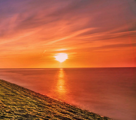 Beautiful sunset at the sea. Sunset over the sea. Sunset over the sea.