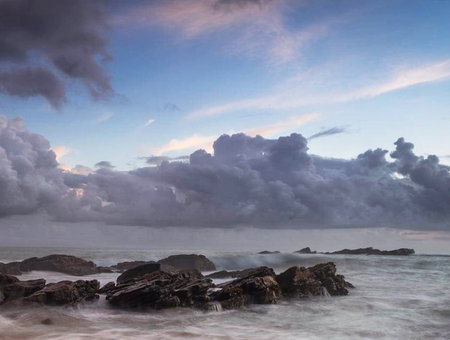 Beautiful seascape at sunset with clouds over the ocean.の写真素材