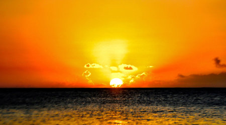Beautiful sunset over the sea. The sun sets over the ocean.の写真素材