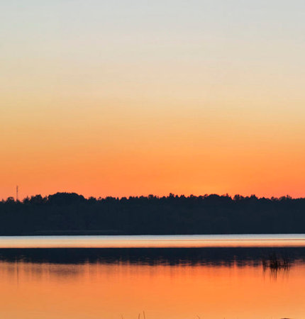 beautiful sunset on the lake with reflection in water, nature series