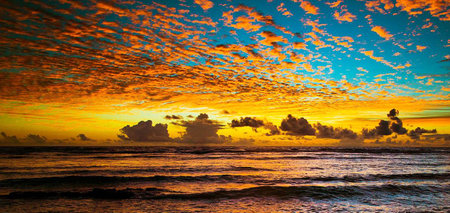 Beautiful sunset over the sea. Beautiful sky with clouds at sunset.