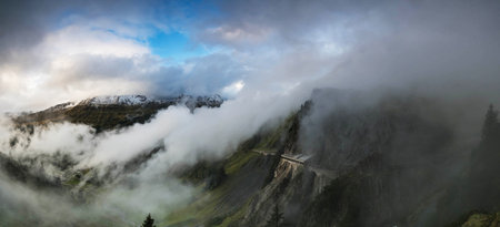 Panoramic view of the Swiss Alps in the morning mist.