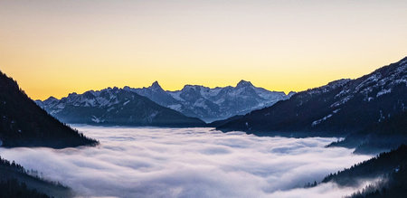 Sunrise over the misty alps