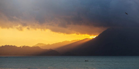 Sunset over the sea with dramatic sky and clouds. Beautiful landscape.の写真素材