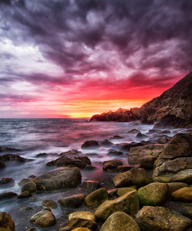 Beautiful sunset over the sea. Dramatic sky, seascape.の写真素材