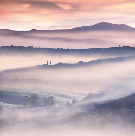 Beautiful Tuscany landscape with fog in the morning, Italyの写真素材