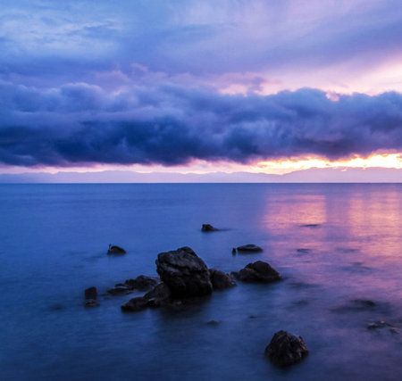 Beautiful seascape at sunset. Dramatic sky over the sea.の写真素材
