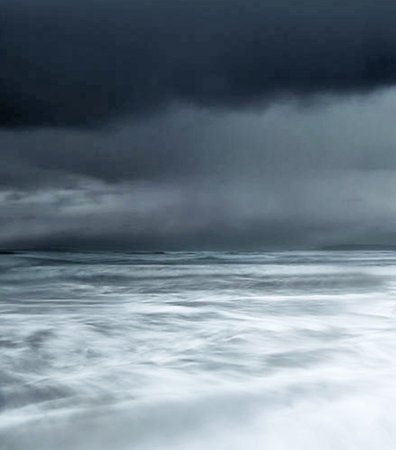 Stormy seascape with waves and dark clouds in the foregroundの写真素材