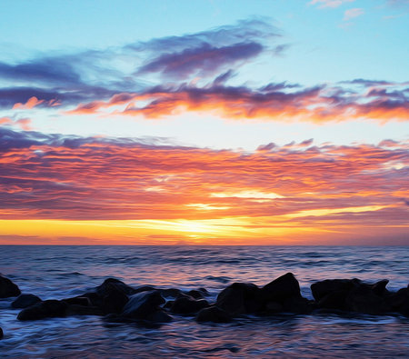 Beautiful sunset over the sea. Colorful sky with clouds.の写真素材