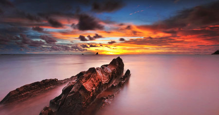 Beautiful seascape at sunset. Dramatic sky, long exposure