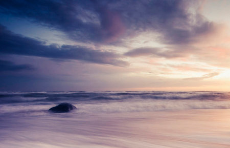 beautiful seascape at sunset with dramatic sky, long exposureの写真素材