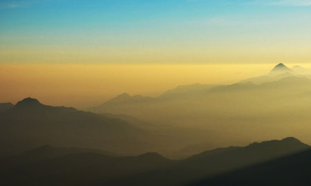 Mountain range in the mist at sunrise, Chiang Mai, Thailandの写真素材