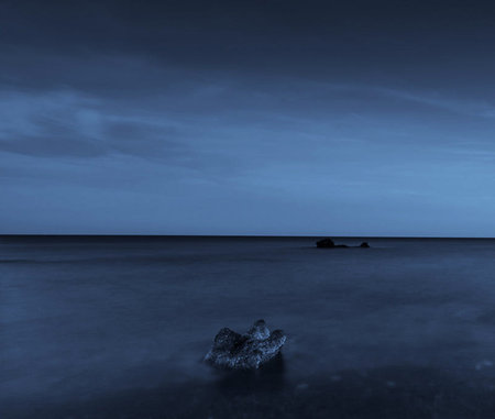 Beautiful seascape at night. Long exposure. Toned.の写真素材
