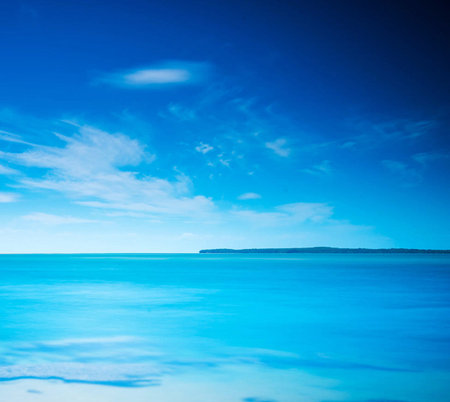 Beautiful seascape. Blue sky and white clouds over calm sea.の写真素材