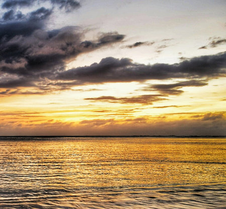 Beautiful seascape with dramatic sky and clouds at sunset.の写真素材