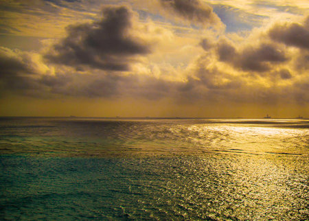 Beautiful sunset over the sea with clouds in the sky, Maldivesの写真素材