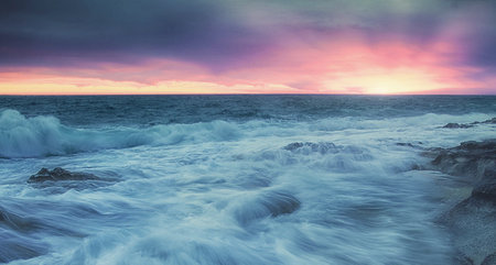 Beautiful seascape at sunset. Dramatic sky, long exposure.