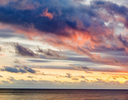Dramatic sunset over the sea. Colorful cloudscape.の写真素材