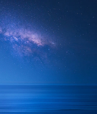 Milky way over the sea with stars and space for your textの写真素材